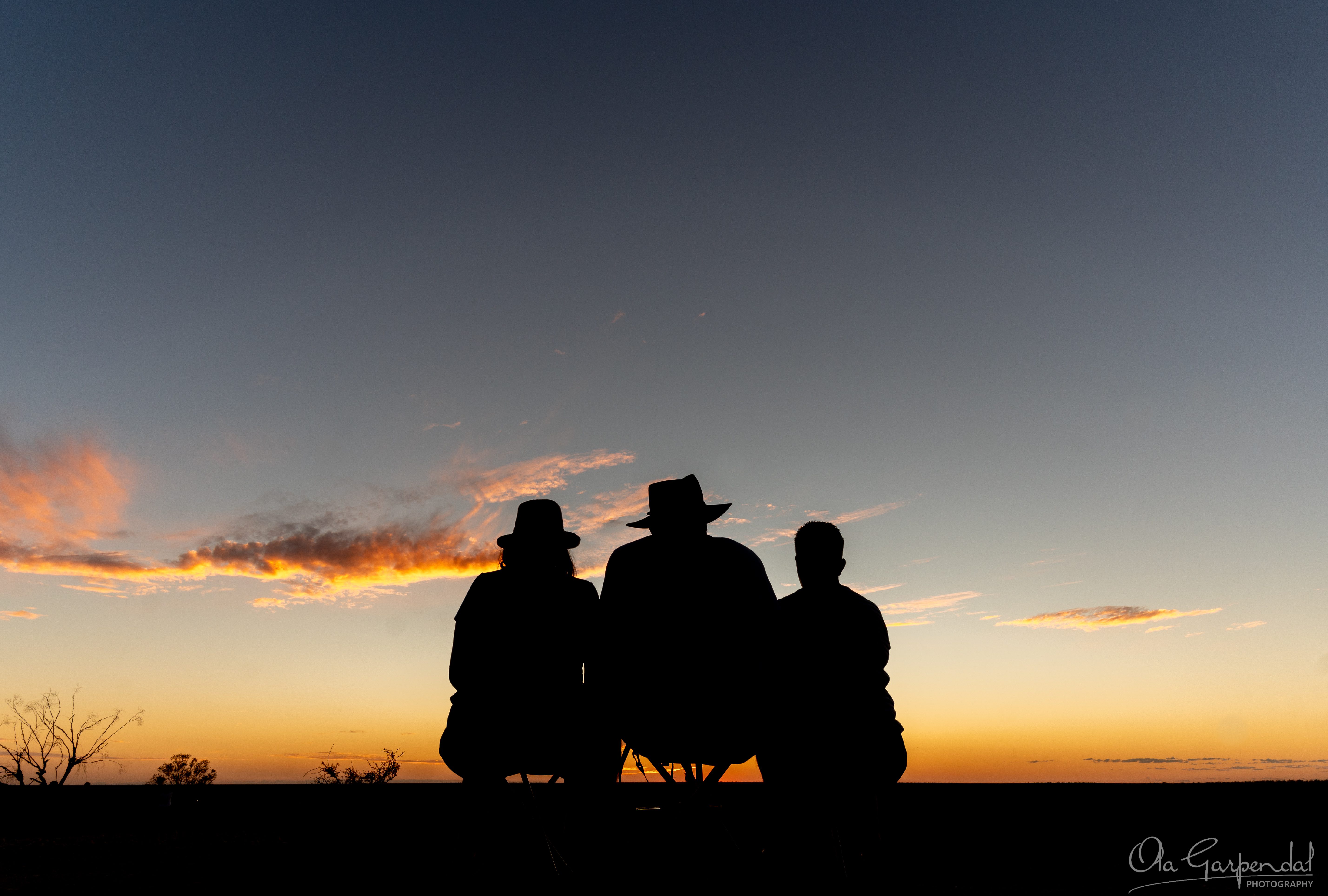 The Three Amigos watching the sun set at Lightning Ridge Green Car Door Tour
