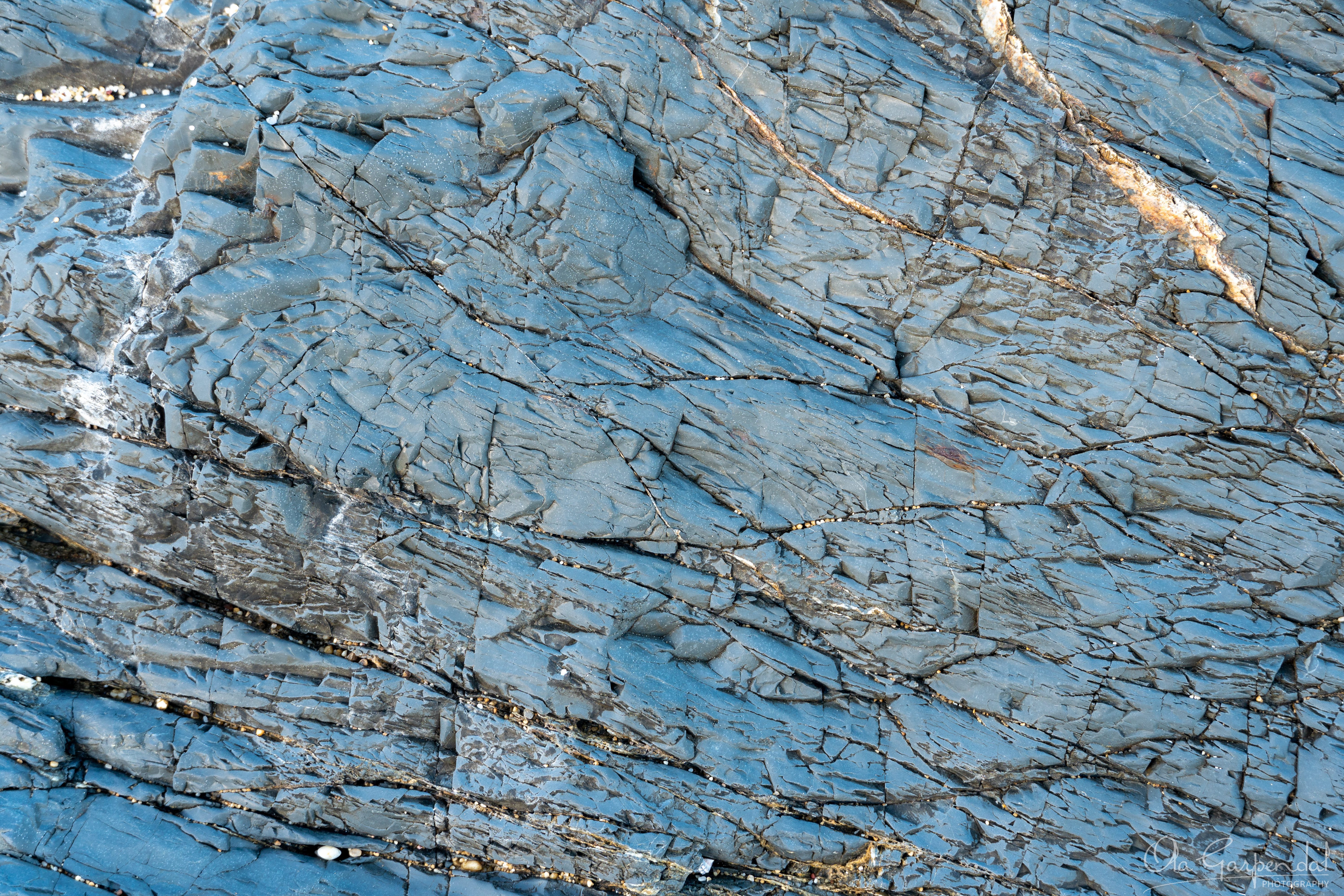 Grey Rock at Pebbly Beach, fine art print from Yuraygir National Park showing the grey-blue rock surface in the afternoon sun, photographed by Ola Garpendal Photography