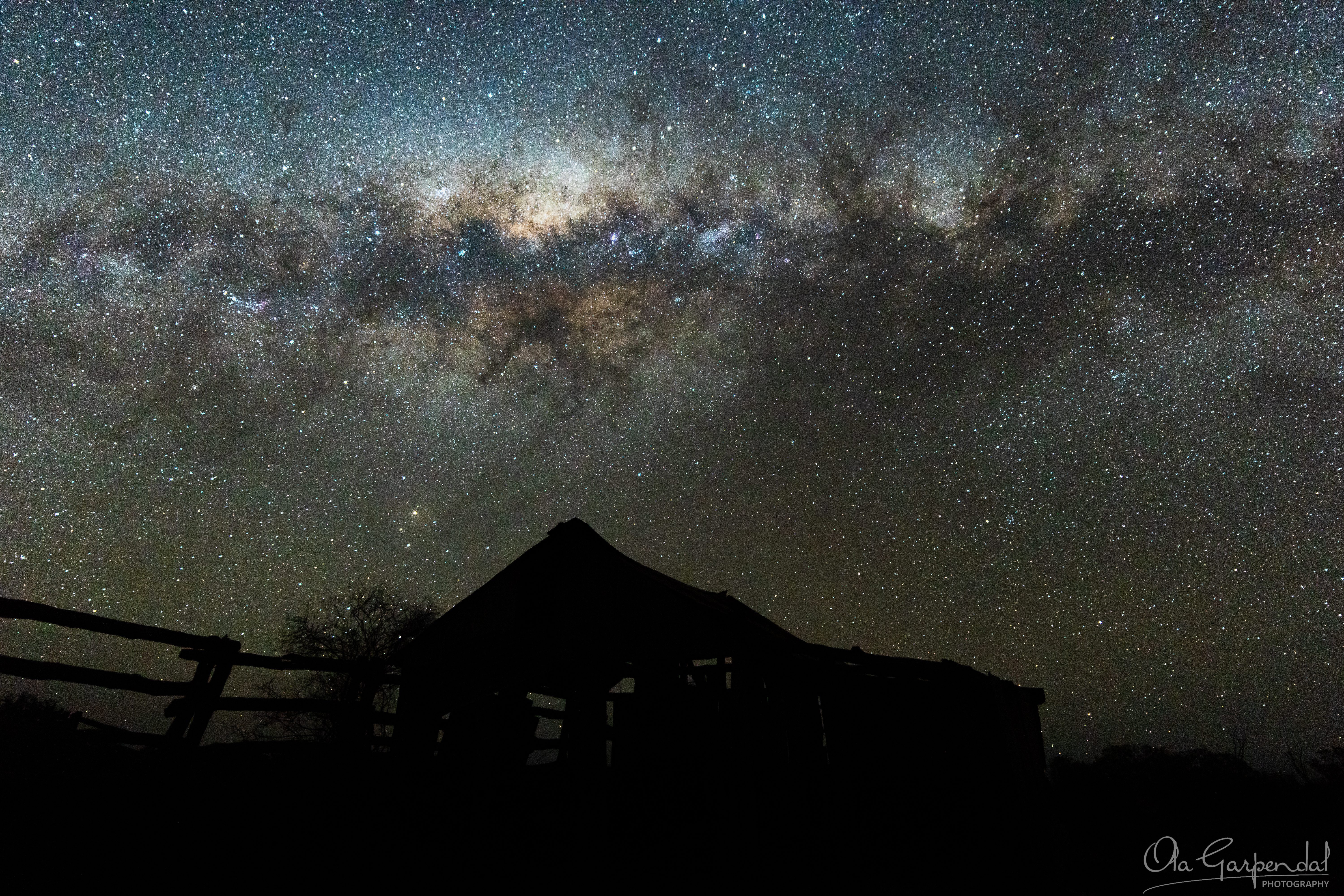 Milky Way over Rose Isle Station, Milky Way arches over an old barn, photographed by Ola Garpendal Photography