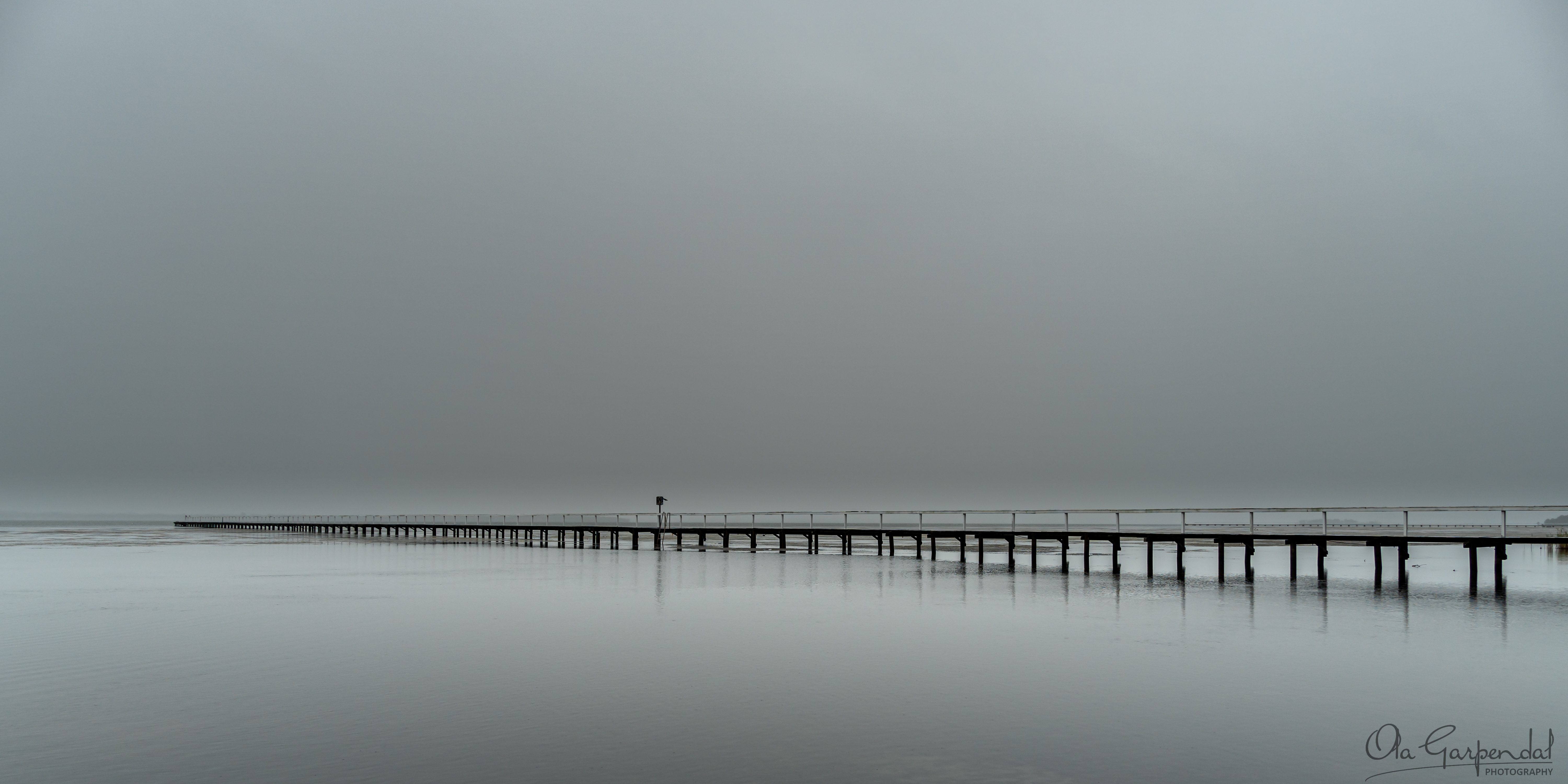 New Year's Day at Long Jetty, jetty in misty weather, monochromatic, photographed by Ola Garpendal Photography